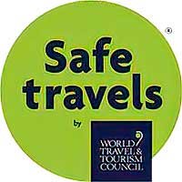Safe Travels certification logo, confirming health and safety standards for tours with Authentic Travel Belize.